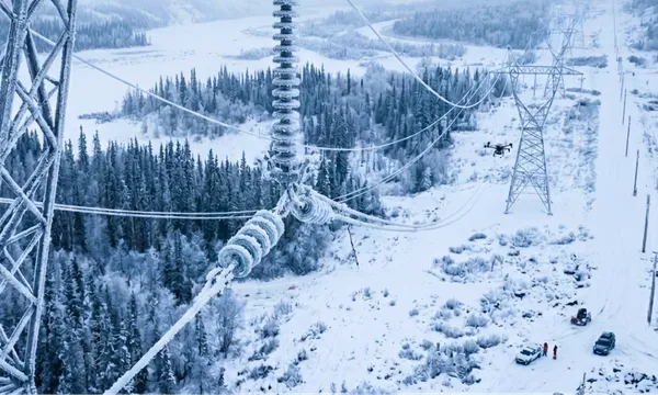 Drone inspecting power transmission lines