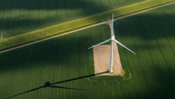 Drone inspecting wind turbine blades